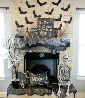 Spooky Halloween Mantel with bats, spider webs and skeletons