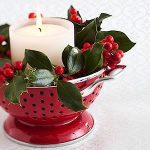 red Christmas Colander Centerpiece with candle and holly berries