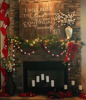 rustic christmas Mantel with wood sign and greenery garland