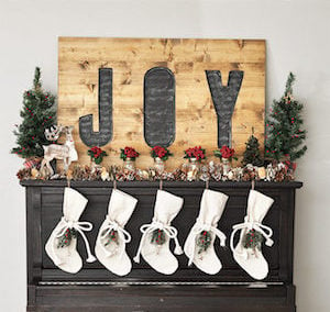 rustic Woodland Christmas Mantel with wooden joy sign
