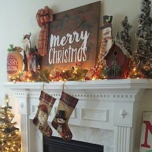 Rustic Merry Christmas Mantel with stockings hanging