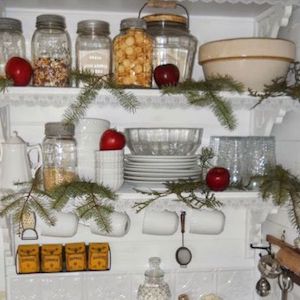 Small Christmas Pantry Decorated with Evergreen Clippings and Ornaments
