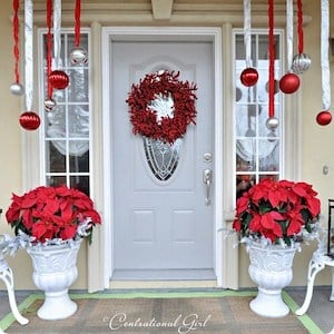 Simple Christmas Porch with Poinsettias and hanging ornaments
