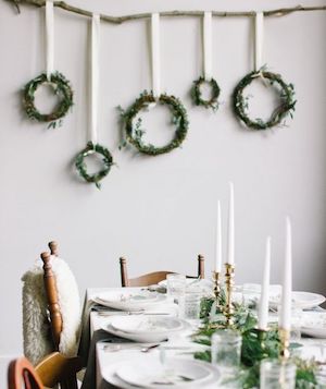 Scandinavian wreaths hanging on dining room wall