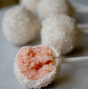 Pink Champagne Cake Pops with white sprinkles