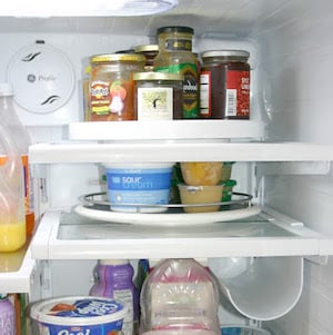 Upper Shelves Fridge organization Using Lazy Susans for Bottles