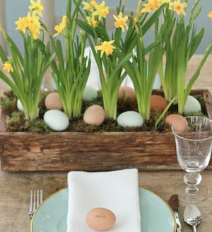 easter eggs and flowers in planter box table decor