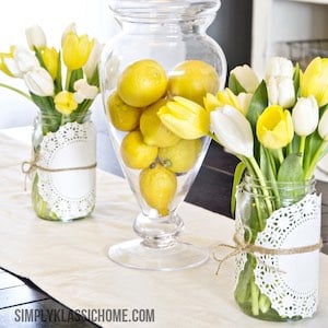 Tulips and lemons in vases easter table decor