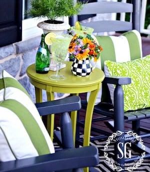 rocking chairs with green and white outdoor cushions