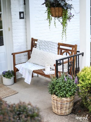 Front Porch Bench with potted plants 