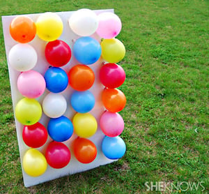 Juego de jardín de dardos con globos
