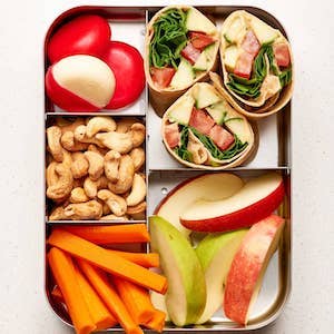 Hummus Wrap with Apple Slices and Carrot Sticks