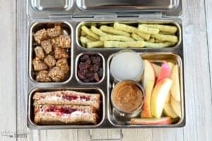 Granola bites apples with almond butter and cream cheese and jelly sandwich lunch box for kids