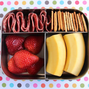 Salami and Crackers Bento lunch Box with Strawberries and Bananas