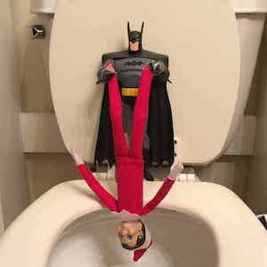 Batman Dangling Elf over the Toilet