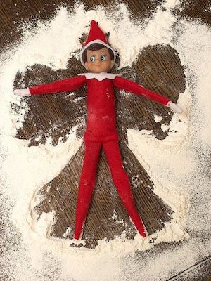 Elf Making a Snow Angel with flour
