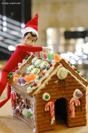 Elf Eating Gingerbread House 