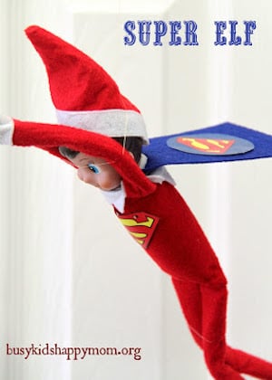 Elf wearing superman costume 