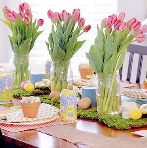 Festive Easter Tablescape with Tulips and Dyed Eggs on a moss table runner
