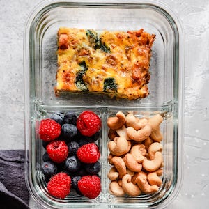 Healthy Meal Prep Bowl with fruit nuts and eggs