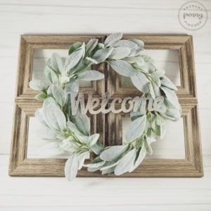 farmhouse faux window out of picture frames with greenery wreath