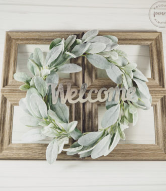 farmhouse faux window out of picture frames with greenery wreath