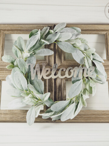 farmhouse faux window out of picture frames with greenery wreath