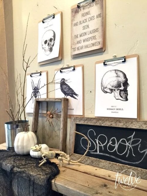 printable vintage halloween wall decor on a clipboard