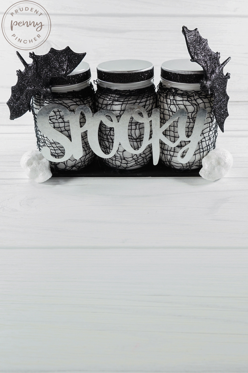 vertical image of mason jar halloween centerpiece