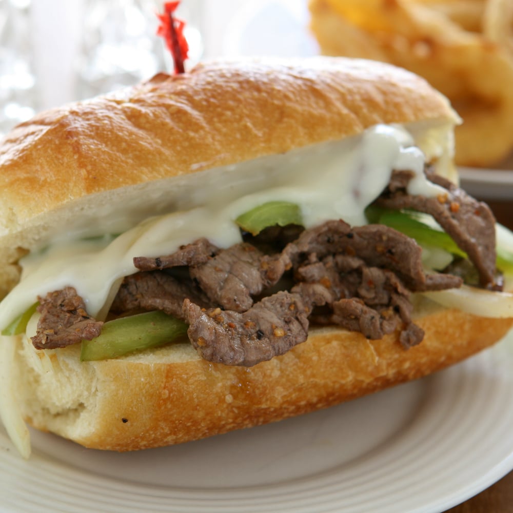 close up of Philly Cheesesteak Sandwiches on a plate