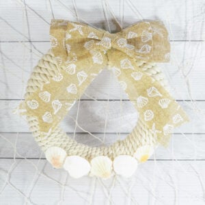 Dollar Tree Coastal Rope Wreath with a seashell bow and seashells