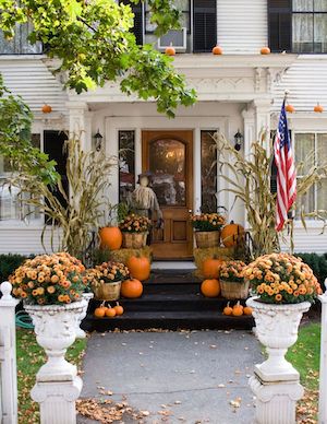 Orange Pumpkins and orange mums on front stairs