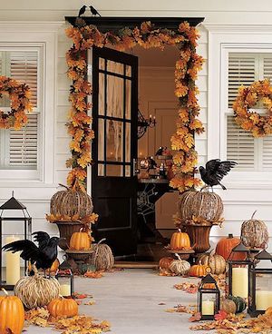 Halloween Porch with fall door garland, grapevine pumpkins and lanterns