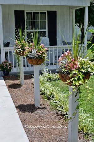 flower planters on fence posts