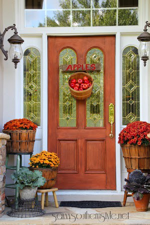 apple bushel door basket with mums next to the door