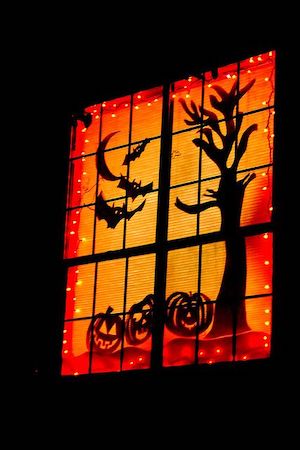 orange and black lit up window decoration for halloween