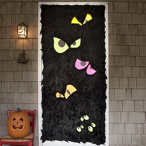 furry black front door with scary eyes