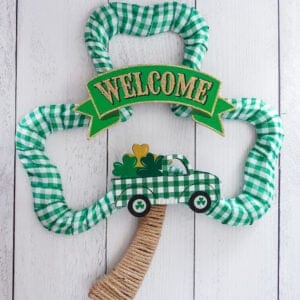 buffalo check green ribbon st patrick's day wreath with welcome sign and green truck