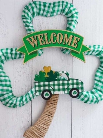 buffalo check green ribbon st patrick's day wreath with welcome sign and green truck