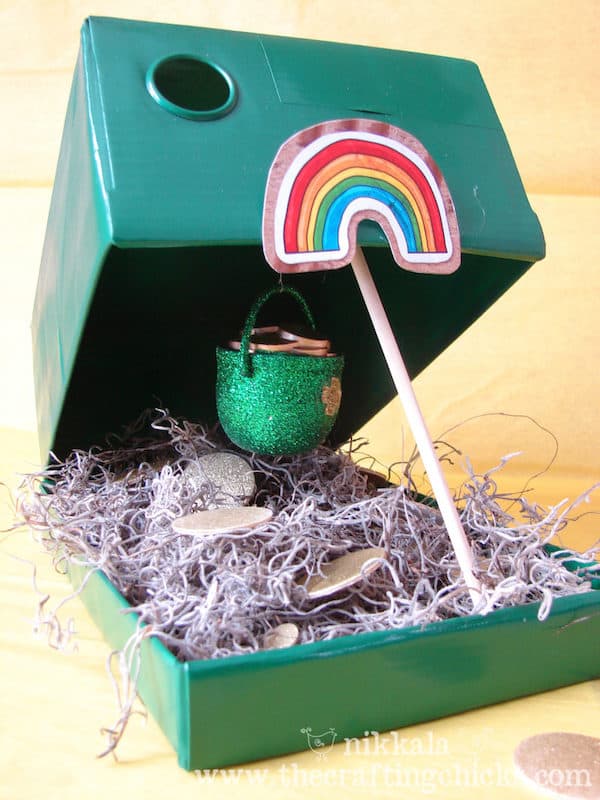shoe box filled with moss and pot of gold under a rainbow sticker