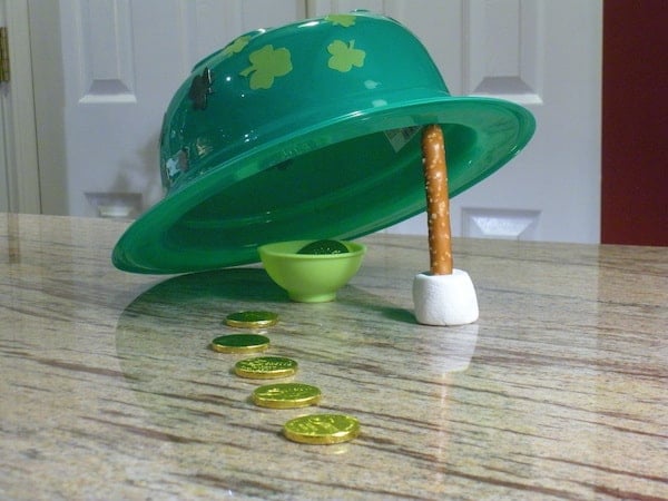 plastic top hat and stick trap with gold coins