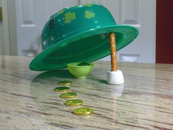plastic top hat and stick trap with gold coins