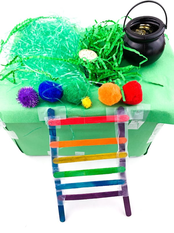 green box trap with rainbow ladder