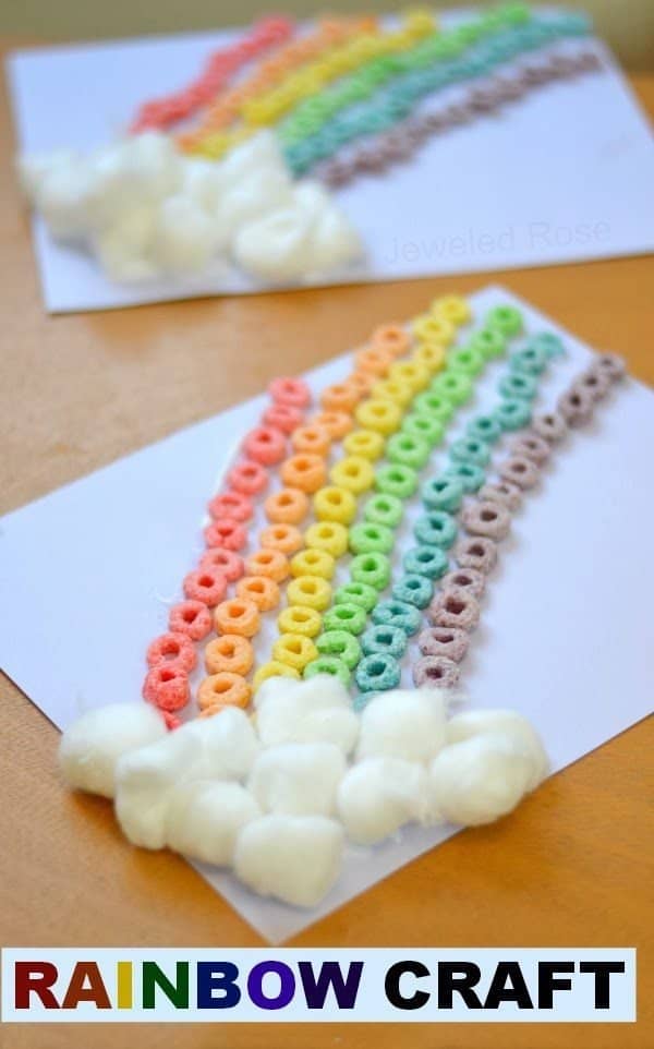 Fruit Loop Rainbow with cotton ball clouds on paper St Patrick's Day Craft for Kids