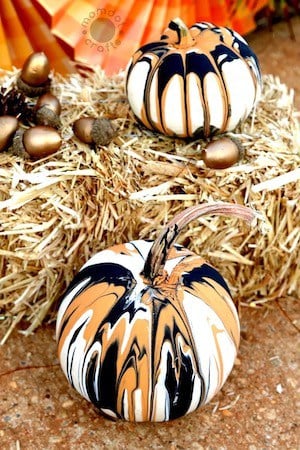 orange and black paint pumpkins