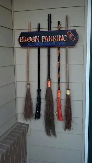 Witch's broom parking sign halloween