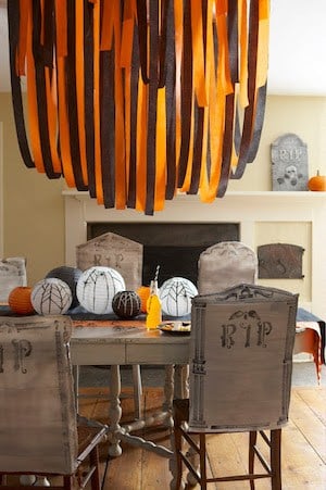 orange and black party streamers over table