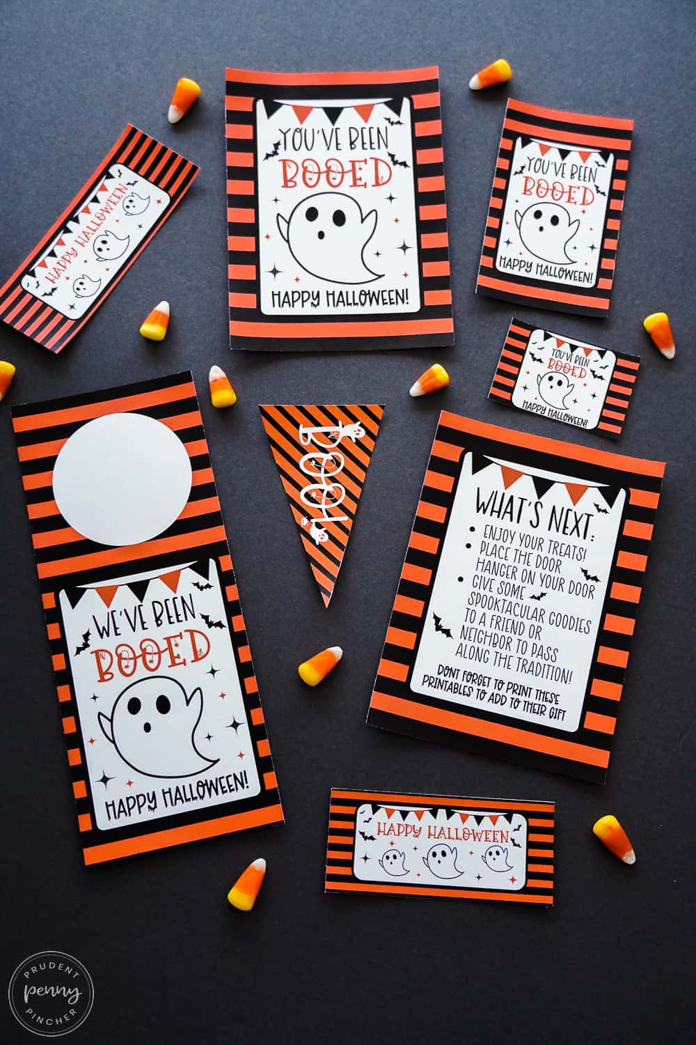 signs, tags and flag surrounded by candy corn on a black background