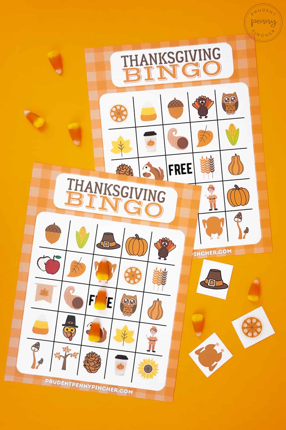 two sheets of bingo cards with candy corn and square calling card pieces