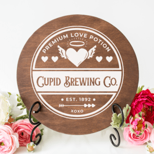 cupid brewing co. round wall art door hanger